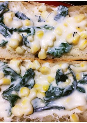 A picture of Spinach and Corn open faced sandwich.