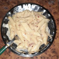 A picture of White sauce cheese pasta.