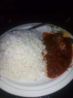 A picture of White Rice and stew.