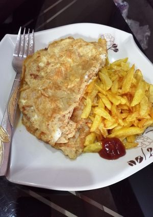 A picture of Fried potatoes and egg.