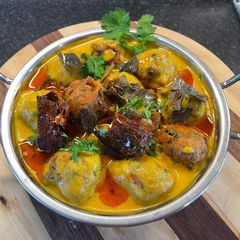 A picture of Punjabi Kadhi Pakora (gram flour fritters Curry).