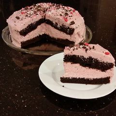 A picture of Chocolate Layer Cake with Cherry Cheesecake Filling and Frosting.