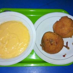 A picture of Akara(bean balls) with custard.