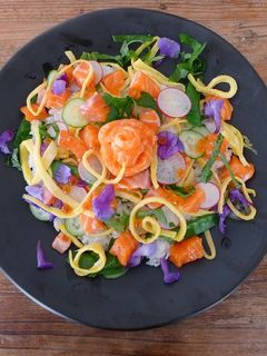 A picture of Salmon oyako chirashi sushi.