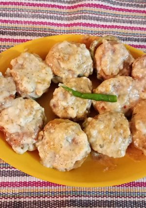A picture of Bhat karela pur with white sauce.