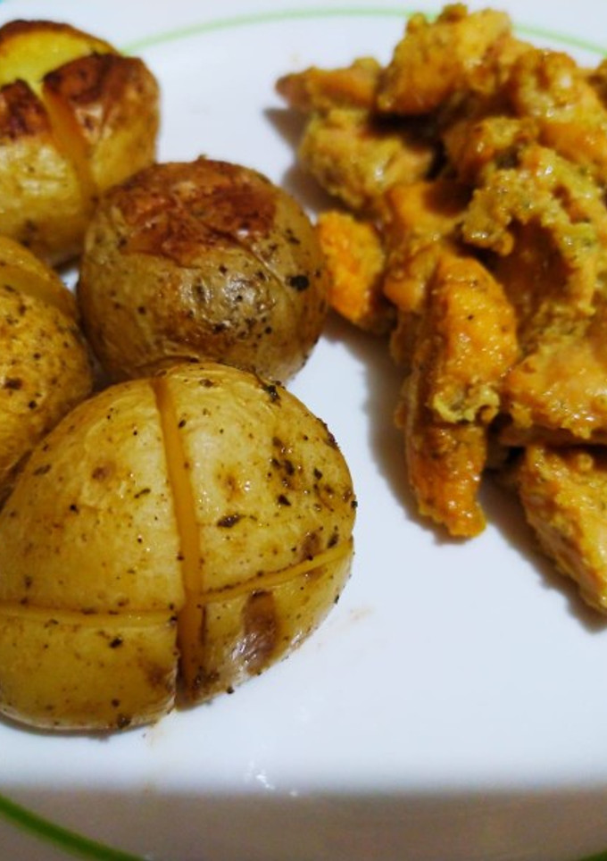 Una foto de Pollo al ajillo con patatas babys al horno