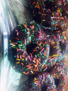 A picture of Doughnuts with Homemade Chocolate Sauce.