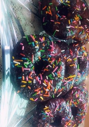 A picture of Doughnuts with Homemade Chocolate Sauce.