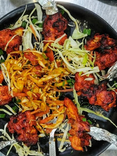 A picture of Chicken kebab With Fried Cabbage.