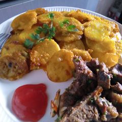 A picture of Viazi karai and wetfry beef.