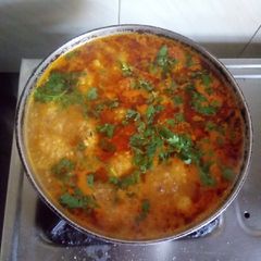 A picture of Rasiya Muthiya (Rice dumplings in curry).