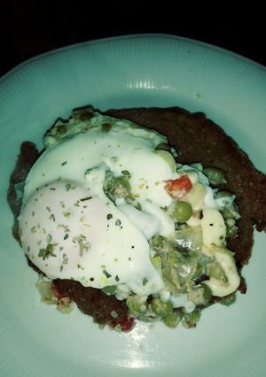 Una foto de Milanesas con colchón de arvejas