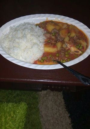 A picture of Beef stew and rice.