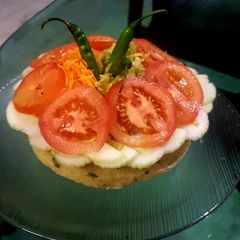 A picture of Protein cake full of salad.