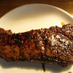 A picture of Steak on the Grill.