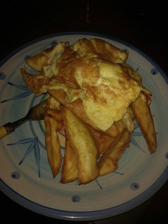A picture of Fried sweet potatoes and egg.