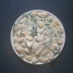 A picture of Gnocchi in rustic Parsley Sauce.