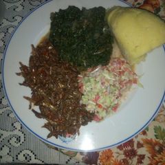 Fried Omena,kienyeji mboga mix,coleslaw salad,semolina ugali A picture of Fried Omena,kienyeji mboga mix,coleslaw salad,semolina ugali.