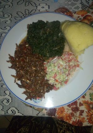 A picture of Fried Omena,kienyeji mboga mix,coleslaw salad,semolina ugali.