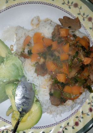 A picture of Beef stew and rice.