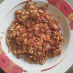 A picture of Potatoes an egg sauce.
