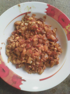 A picture of Potatoes an egg sauce.