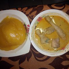 A picture of Egusi pepper soup and starch.