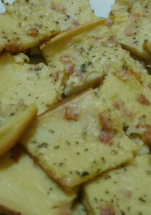 Una foto de Fainá de jamón y orégano