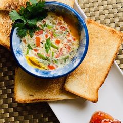 A picture of Cheesy Egg in a bowl.