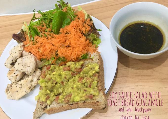 Soy sauce salad with toast bread guacamole and grill blackpaper chicken