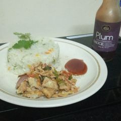 A picture of Braised rice with scrambled eggs,and plum sauce.