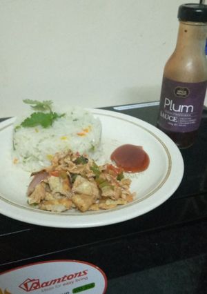 A picture of Braised rice with scrambled eggs,and plum sauce.