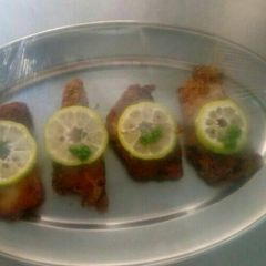 A picture of Deep fried fish coated with breadcrumbs.