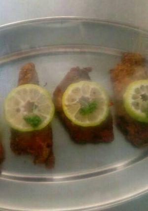 A picture of Deep fried fish coated with breadcrumbs.