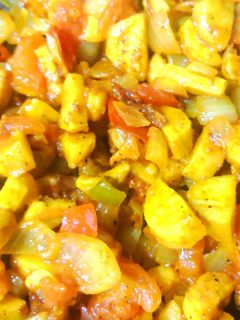 A picture of Arbi with onion and tomato.
