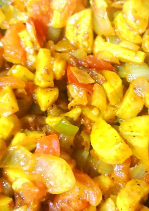 A picture of Arbi with onion and tomato.