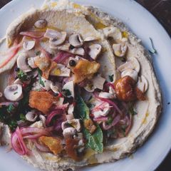 A picture of Cannellini bean purée with pickled mushrooms and pitta croutons.