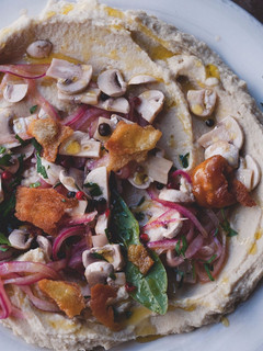 A picture of Cannellini bean purée with pickled mushrooms and pitta croutons.