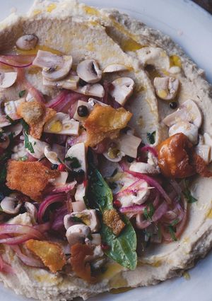 A picture of Cannellini bean purée with pickled mushrooms and pitta croutons.