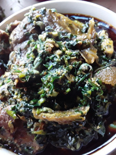 A picture of Spicy GOAT MEAT IN Vegetable Soup.