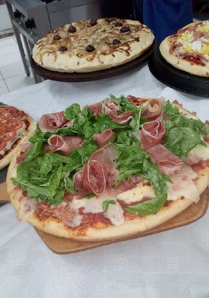 Una foto de Pizzas a la isma