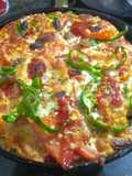 Capsicum onions tomato Pizza