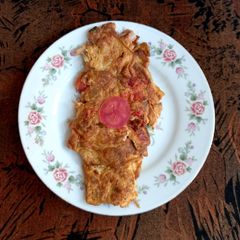 A picture of Omelette with tomato 🍅 🍅.