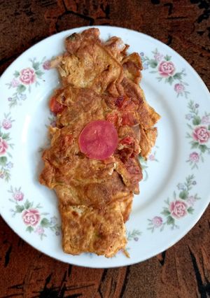 A picture of Omelette with tomato 🍅 🍅.