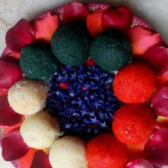 A picture of Tricolor Nariyal Ladoo with Gulkand Stuffing.