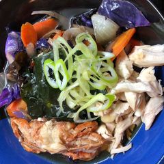 A picture of Ramen 🍜 with Softshell Crab, Tender Chicken and Wakame Seaweed.
