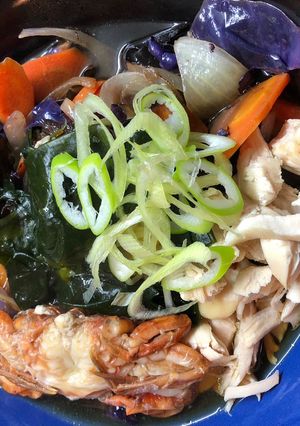 A picture of Ramen 🍜 with Softshell Crab, Tender Chicken and Wakame Seaweed.
