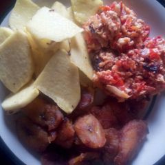 A picture of Fried yam and plantain with scrambled egg sauce.