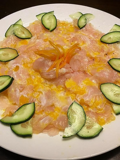Una foto de Tiradito de Corvina y Ají amarillo
