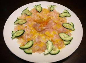 Una foto de Tiradito de Corvina y Ají amarillo